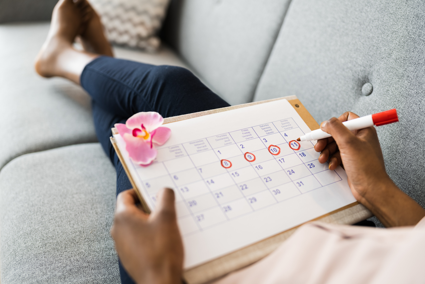 Woman Using Menstrual Cycle Calendar